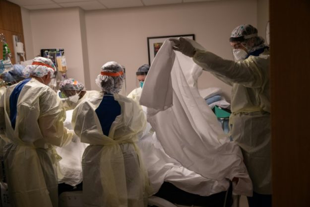 A medical team turns over a patient with COVID-19 in an intensive care unit in Stamford, Connecticut. PHOTO: AFP 