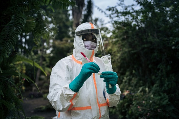 A staff member of the Congolese Ministry of Health prepares the sampling equipment to perform a COVID-19 test at a private residence in Goma, northeastern Democratic Republic of Congo. PHOTO: AFP 