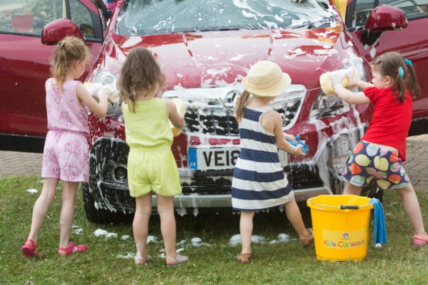 EMBARGOED TO 0001 WEDNESDAY JULY 27 EDITORIAL USE ONLY Children launch the Vauxhall Motors summer ÃKids CarwashÃ franchise in South West London. PRESS ASSOCIATION Photo. Issue date: Tuesday July 26, 2016. Ahead of the school summer holidays, the British car manufacturer is launching their on their website a summer-long initiative to help children unleash their entrepreneurial side. The campaign will offer children everything they need to start their own car washing business, from a car washing equipment starter pack to a step-by-step Ãhow-toÃ guide to washing a car like a pro. Photo credit should read: David Parry/PA Wire