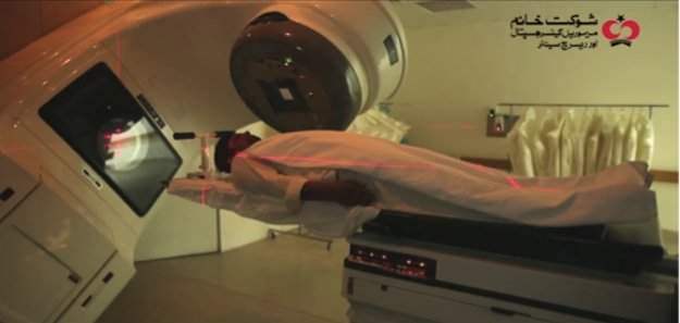 A patient is receiving radiation as part of his treatment through a state-of-the-art linear accelerator at SKMCH&RC