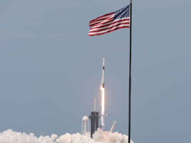 a spacex rocket carrying the crew dragon spacecraft lifts off at the kennedy space centre in florida on may 30 photo afp