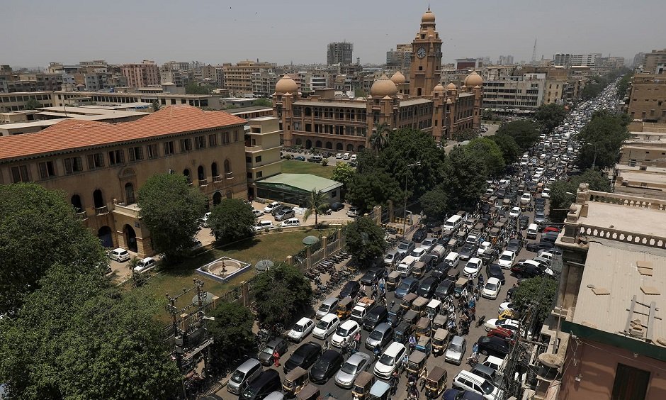 A general view of a road traffic and the Karachi Metropolitan Corporation (KMC) building in the background, after Pakistan started easing the lockdown as the coronavirus disease (COVID-19) continues, in Karachi, Pakistan May 11, 2020. REUTERS