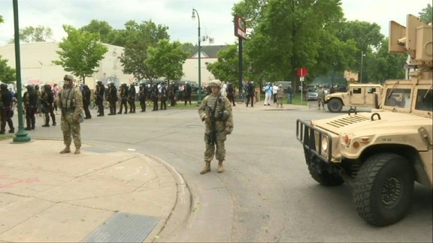 National Guard deployed to Minneapolis stand guard after violent protests overnight. PHOTO: AFP 
