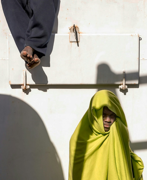 Two migrants are pictured on board the Aita Mari vessel in February after their rescue in international waters. PHOTO: AFP