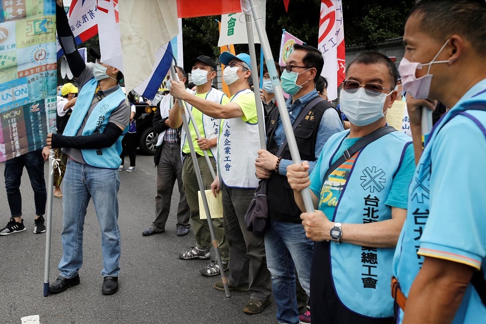 Labour union groups gather for a May Day rally while wearing surgical masks to protect themselves from the coronavirus disease (COVID-19) in Taipei, Taiwan, May 1, 2020. REUTERS/Ann Wang