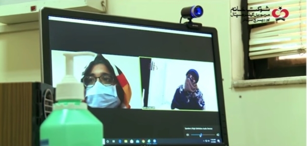 To avoid unnecessary physical interaction, the doctor examines the patient sitting in a separate room via a video call
