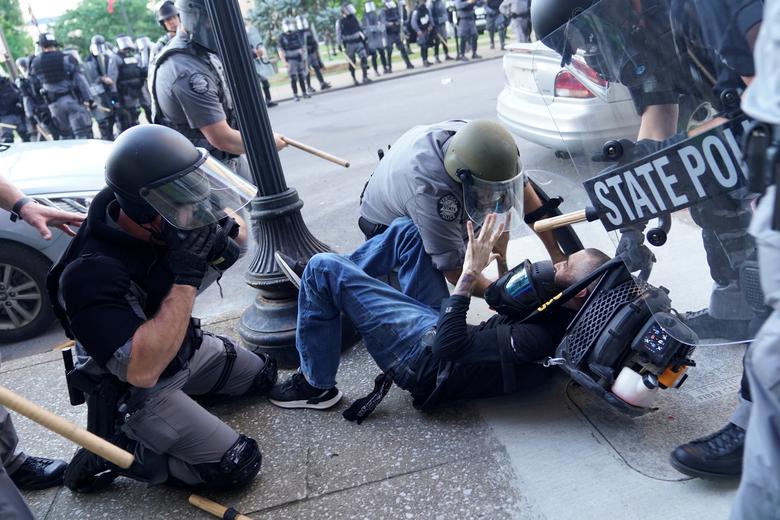 A man is detained during a protest against the deaths of Breonna Taylor by Louisville police and George Floyd by Minneapolis police, in Louisville, Kentucky. Photo: Reuters